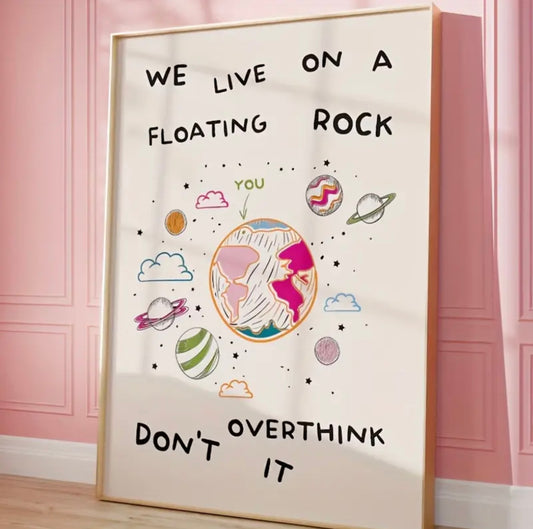 “We live on a floating rock don’t overthink it” Wall Art